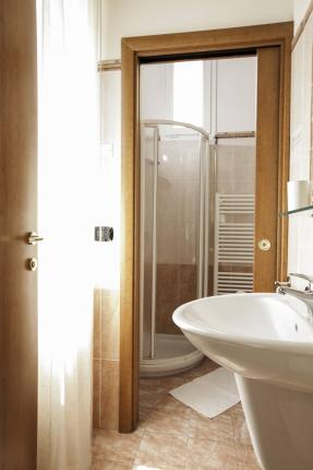 Bright bathroom with shower and sink.