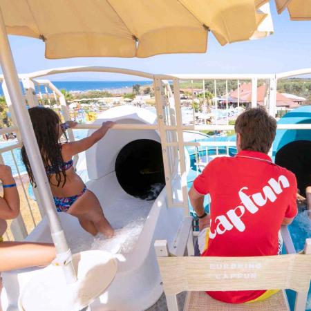 Kids ready to slide at a water park.