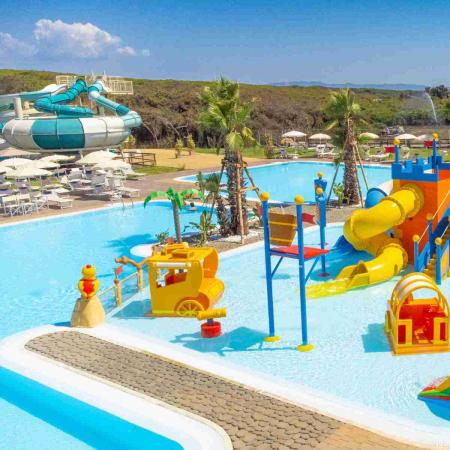 Colorful water park with slides and children's play area.