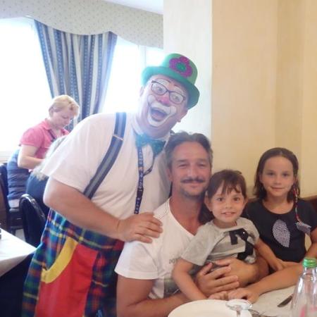 Family with clown in a restaurant, summer 2017.