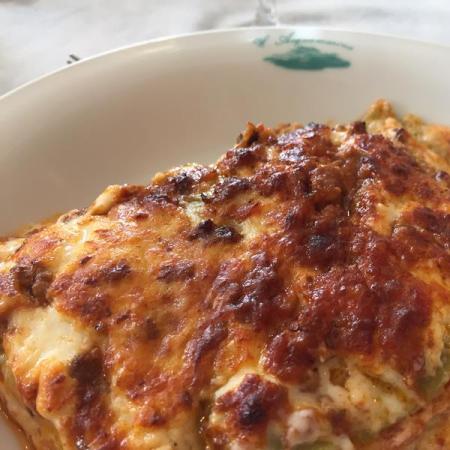 Baked lasagna with golden crust and melted cheese.