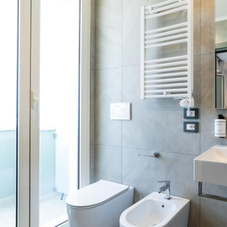 Bright, modern bathroom with elegant fixtures and refined details.