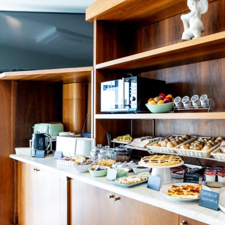 Breakfast buffet with inviting pastries and a cozy atmosphere.