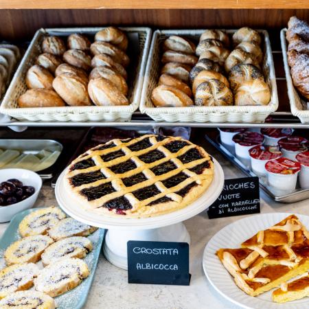 Delicious assorted pastries in a cozy bakery, with irresistible aromas.