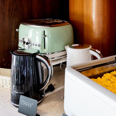 Cozy kitchen with vintage toaster and scrambled eggs.