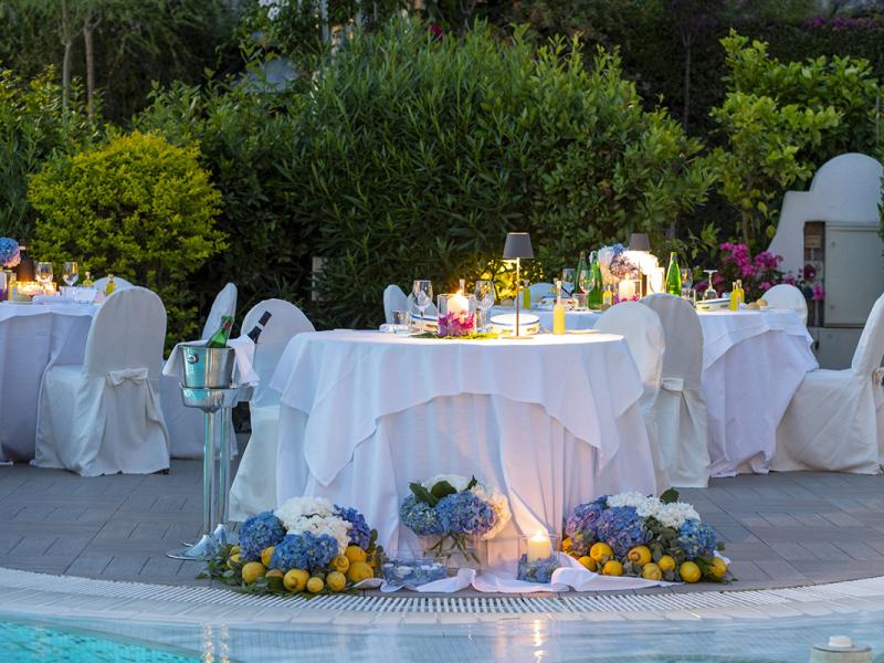 Elegant outdoor tables with flowers and lemons.