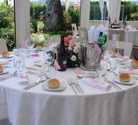 Elegant table with flowers, wine, and bread for a special event.