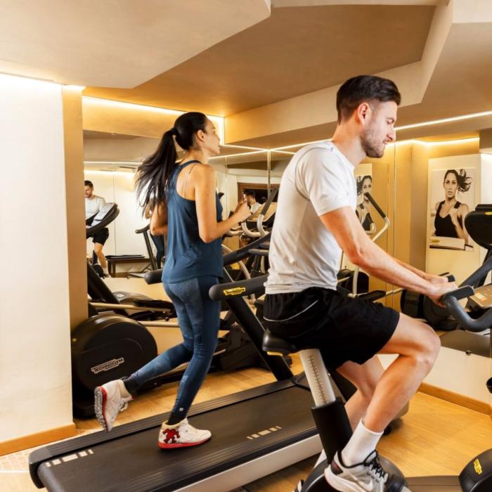 Energetic people exercising in a gym, bright and motivating environment.