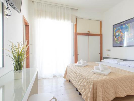 Bright, cozy, and tidy room with a double bed and modern decor.