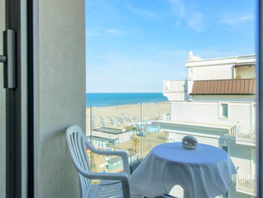 Sea view from a balcony, relaxing atmosphere with blue sky.