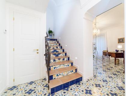 Staircase with colorful tiles in an elegant interior.