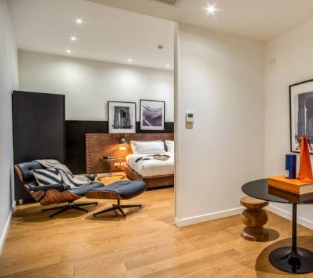 Modern room with elegant furnishings and artwork on the walls.