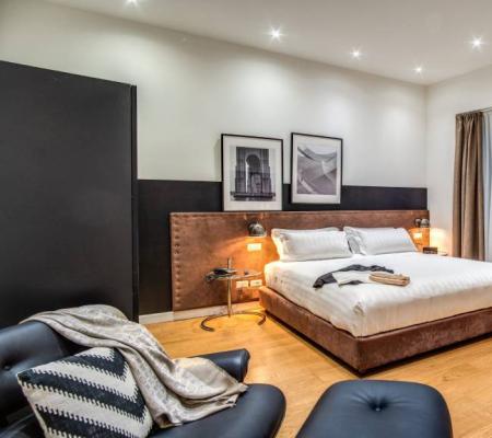 Modern bedroom with a double bed and stylish decor.