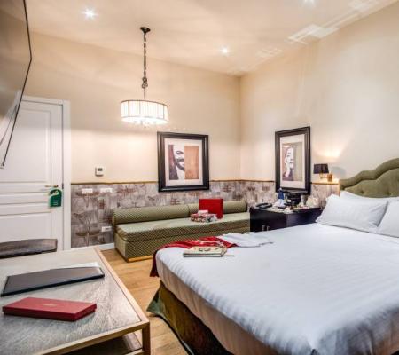 Cozy room with a double bed and elegant decor.