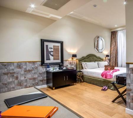 Elegant room with double bed and bathroom.